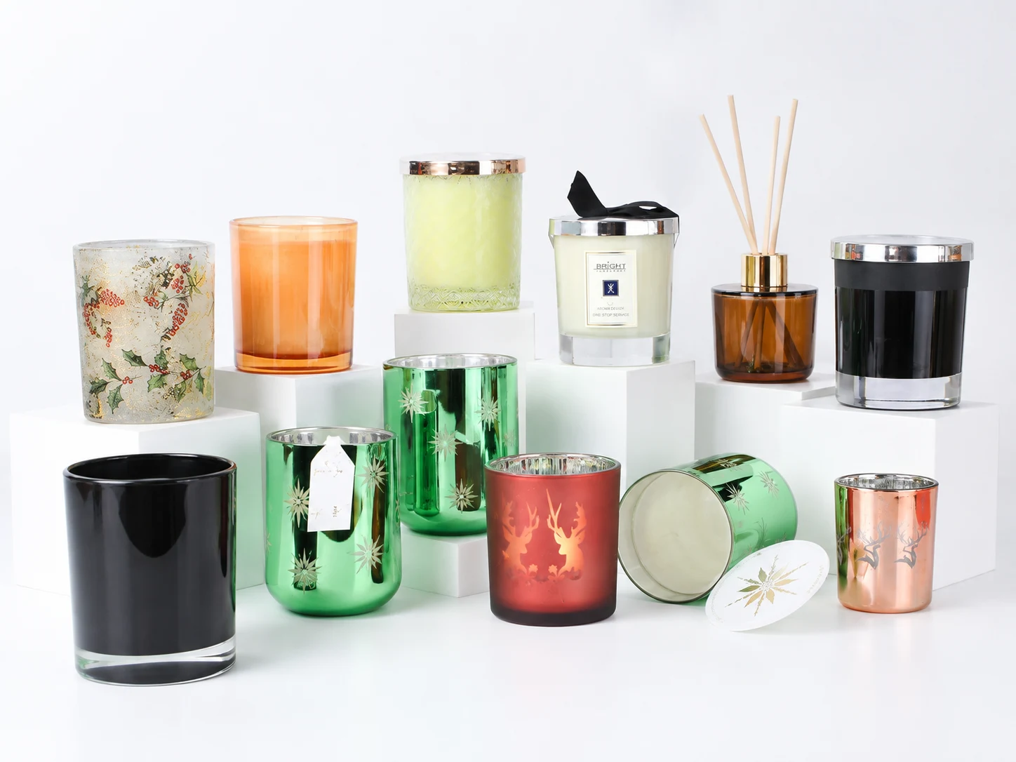 Decorated candle jars with different colors, metallic finishes, and printed branding for surface decoration and brand presentation