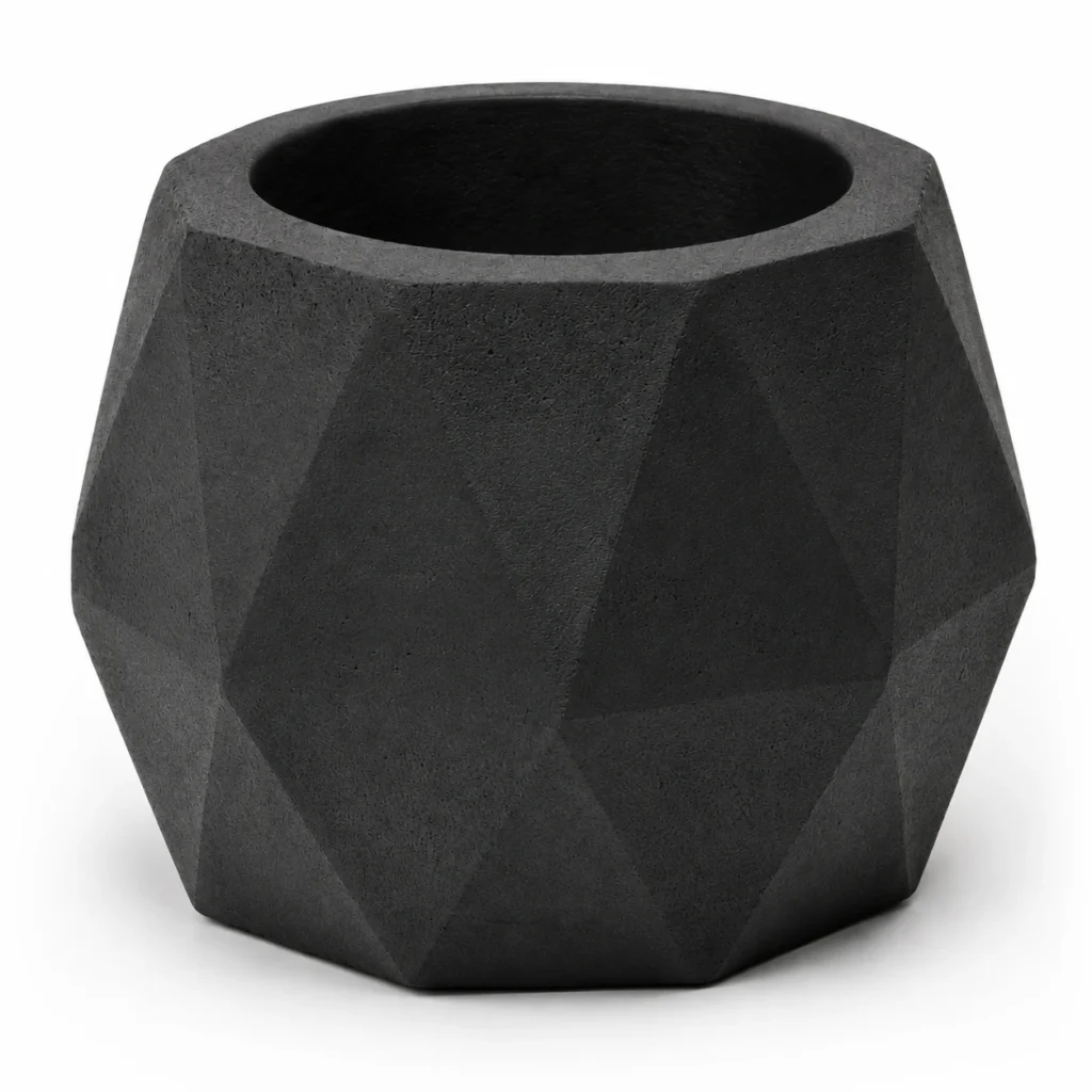 Close-up detail of geometric black concrete candle holder BGCC138 showing faceted texture