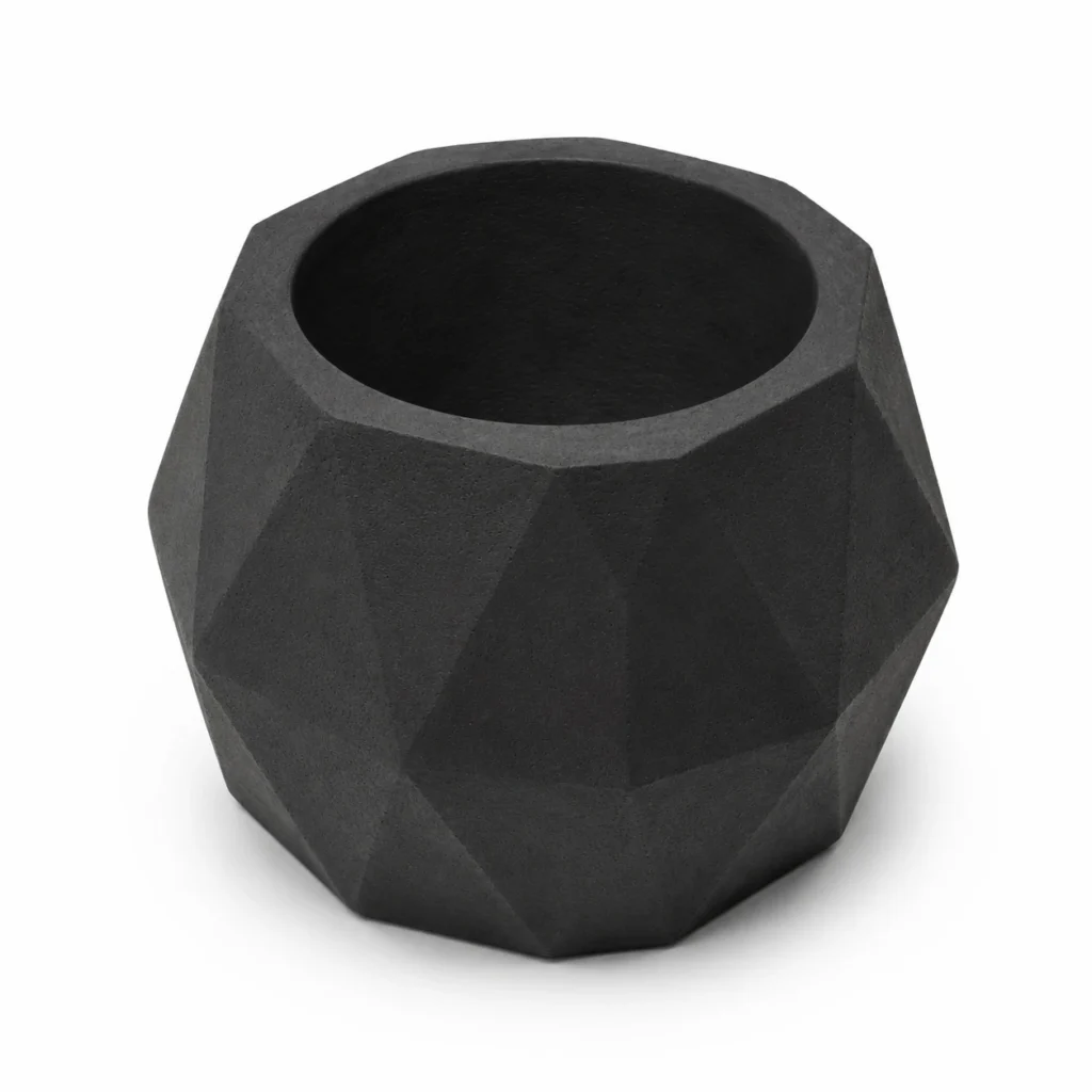Empty black geometric concrete candle holder