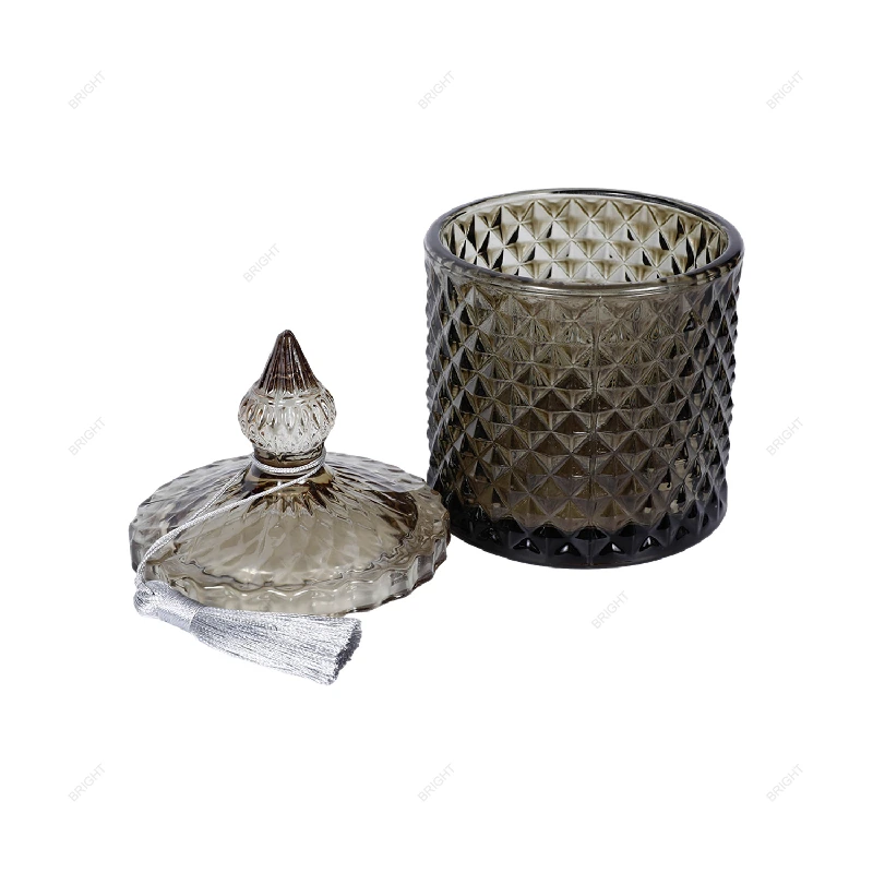 Pink patterned jar shown closed with a pointed lid handle.