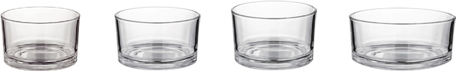 Four wide clear glass candle jars in graduated sizes