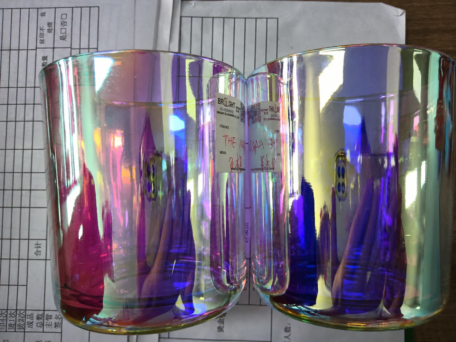 Two iridescent electroplated glass candle jars photographed side by side to compare finish appearance