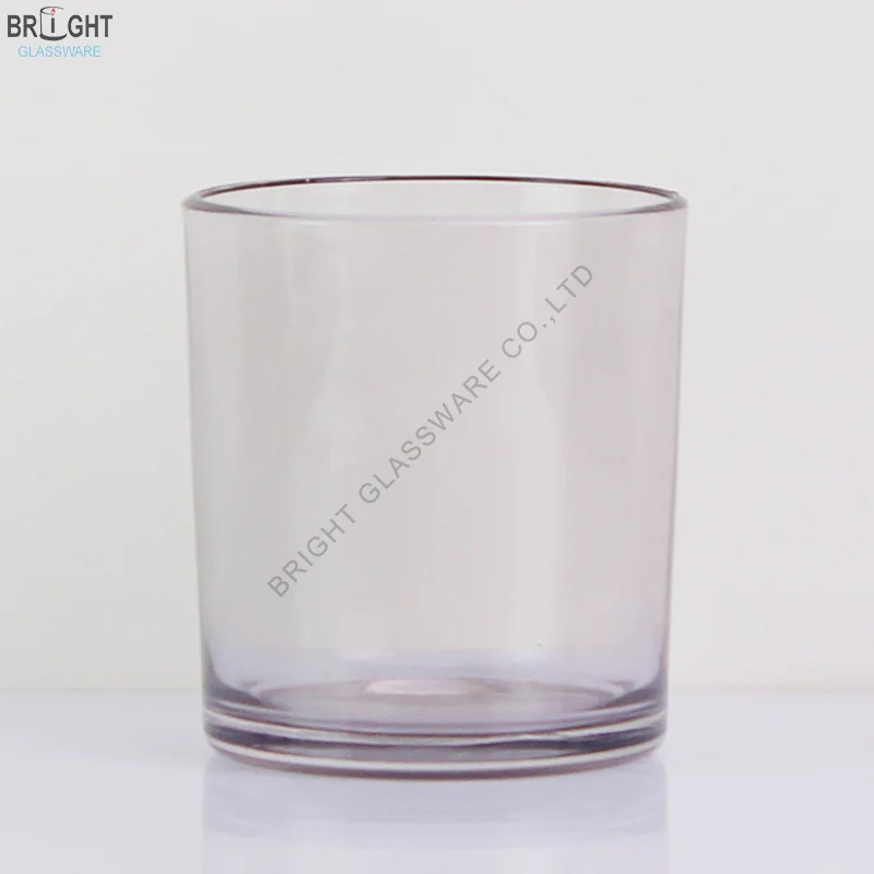 Clear straight sided glass candle vessel with subtle colored base