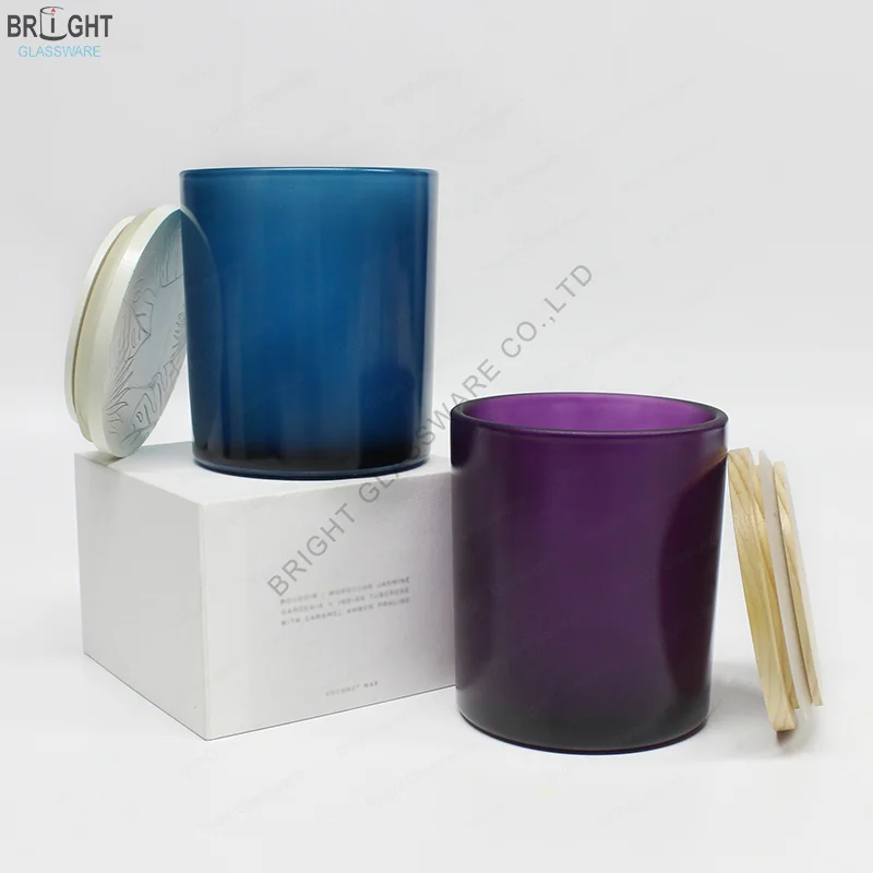 Blue and purple straight sided glass candle jars with matching accessories