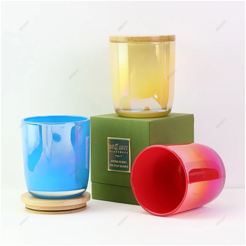 Colored cylindrical candle glasses shown with a matching presentation box