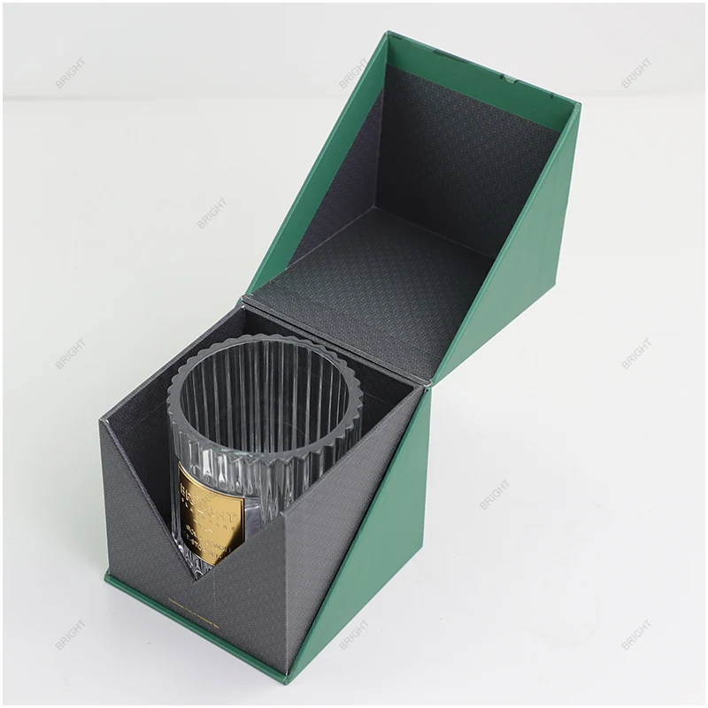 Open presentation box showing a fitted insert around a candle glass