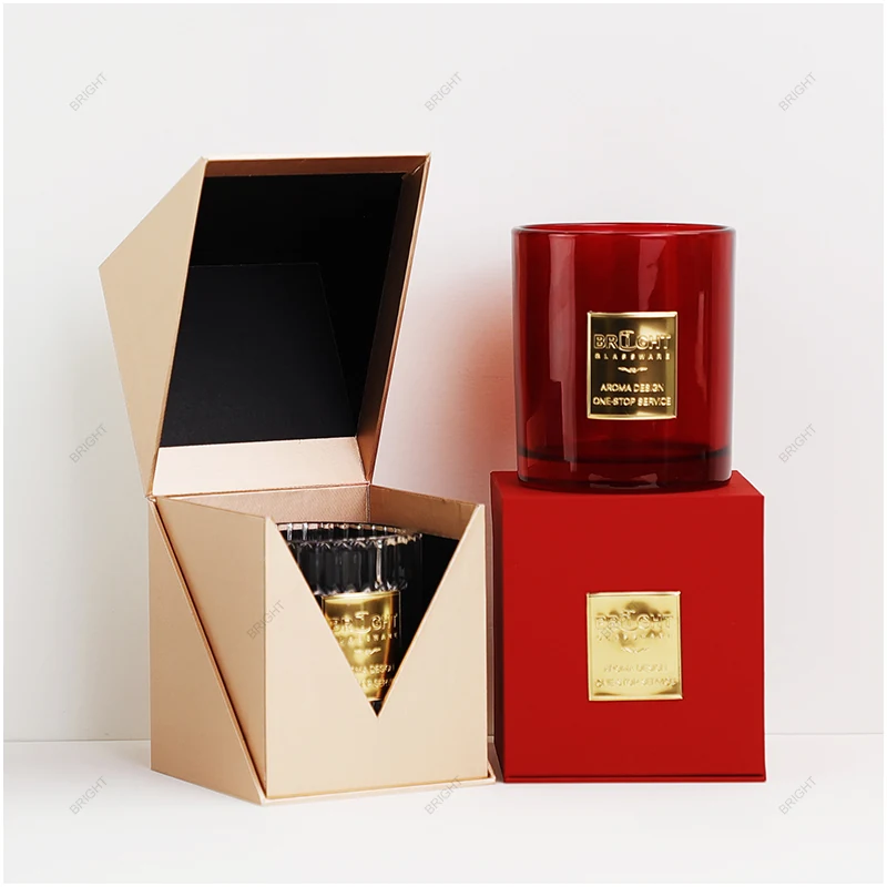 Candle glass, decorative label and open presentation box