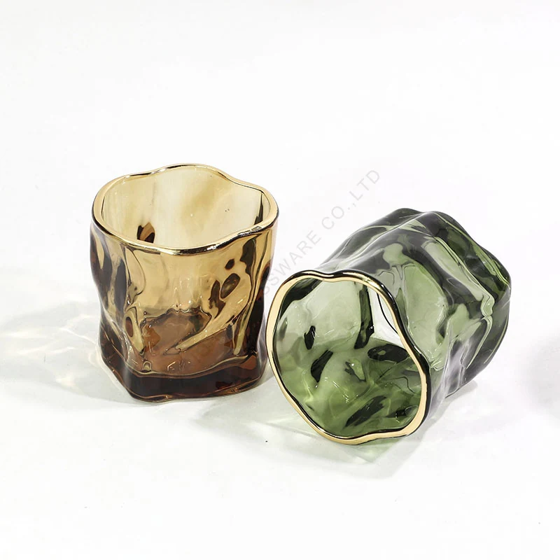 Sculptural amber and green candle glass references