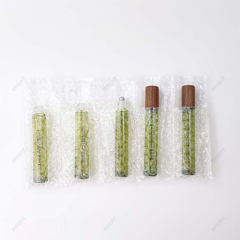 Slim glass roller bottles in individual bubble sleeves