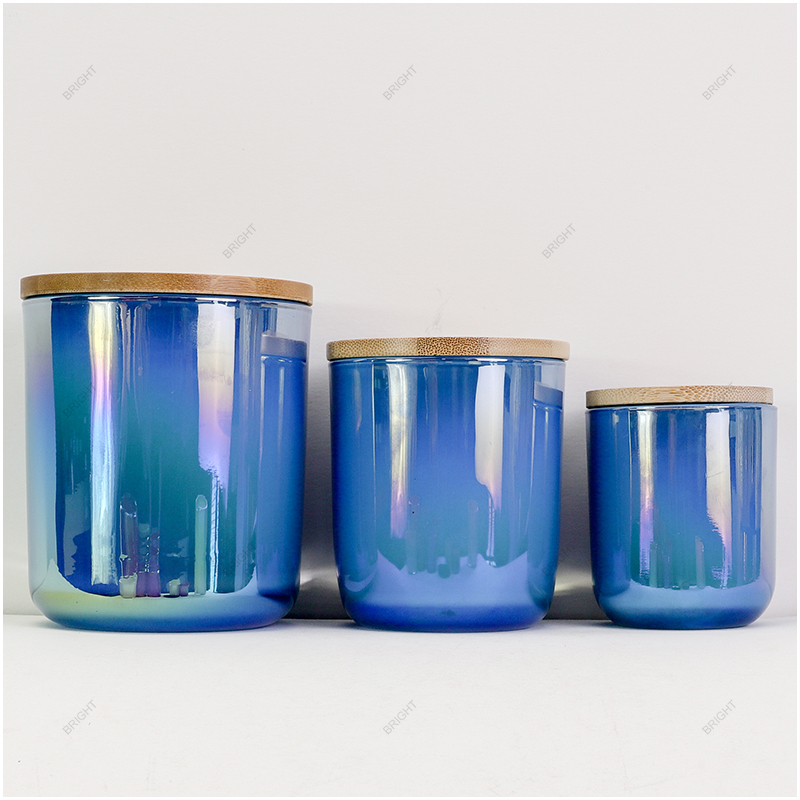 Blue glass candle vessels with a contrasting metallic interior
