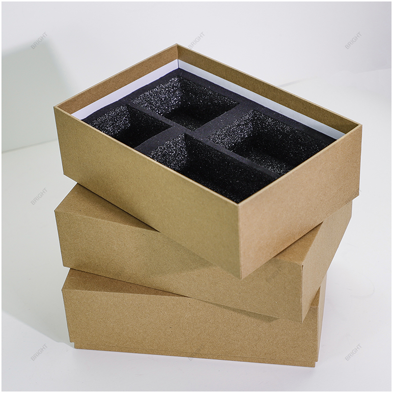 Gold presentation boxes with fitted black foam inserts