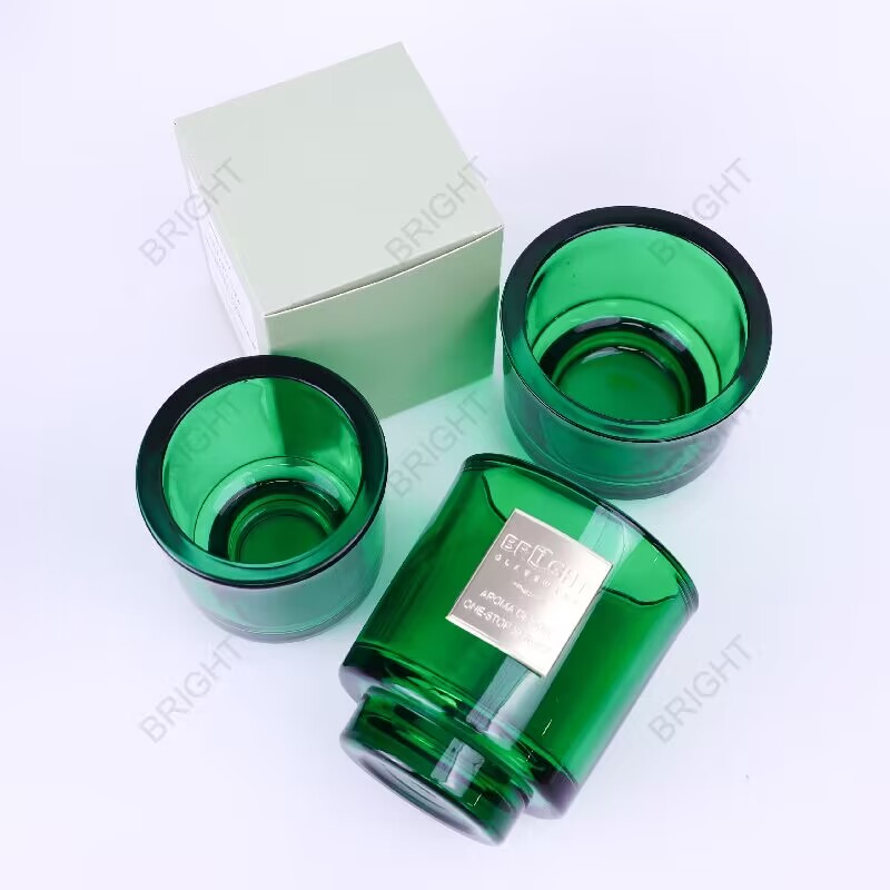 Green glass candle jars showing rims and bases