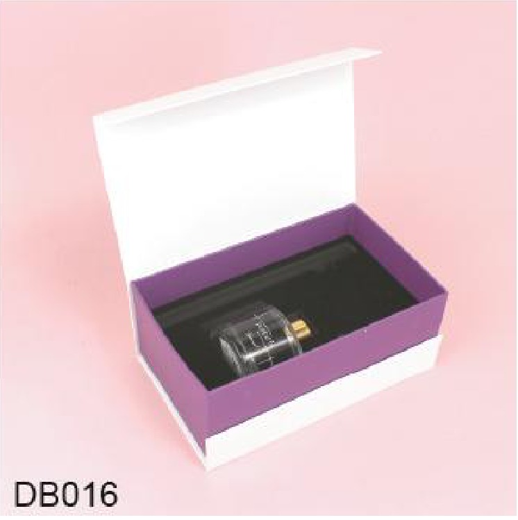 Glass diffuser bottle in an open purple magnetic box Glass diffuser bottle in an open purple magnetic box