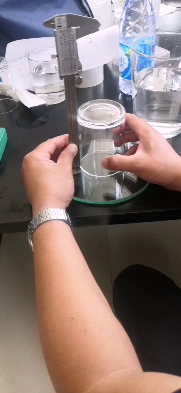 Historical SOP example: checking a clear glass jar with a vertical measuring gauge