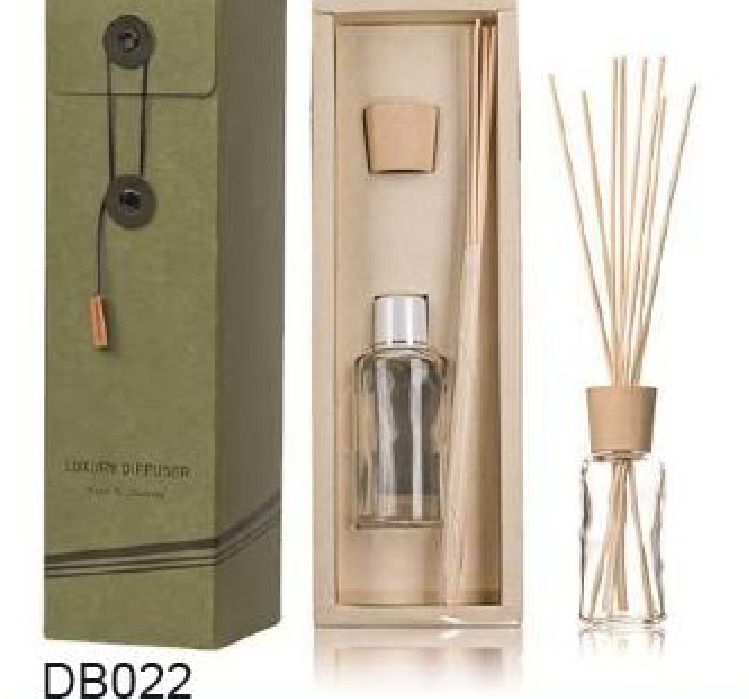 Reed diffuser bottle and separate reed compartment in an open gift box Reed diffuser bottle and separate reed compartment in an open gift box