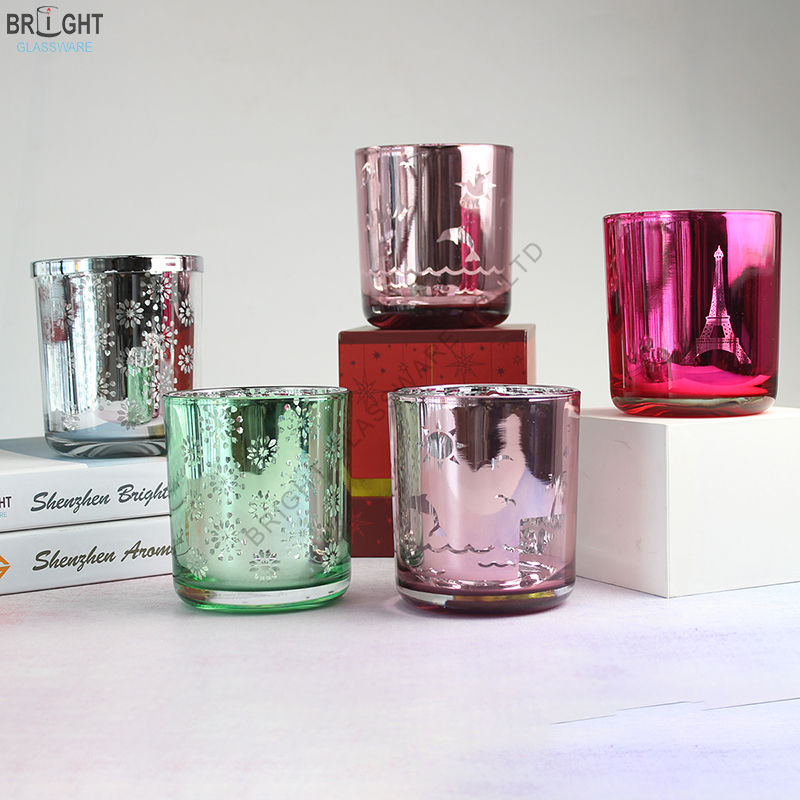 Decorated glass candle jars in silver, green and pink finishes