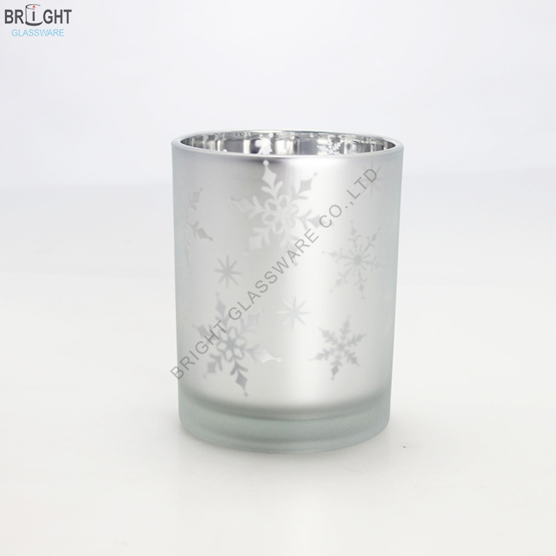 Silver-tone glass candle holder with snowflake patterns