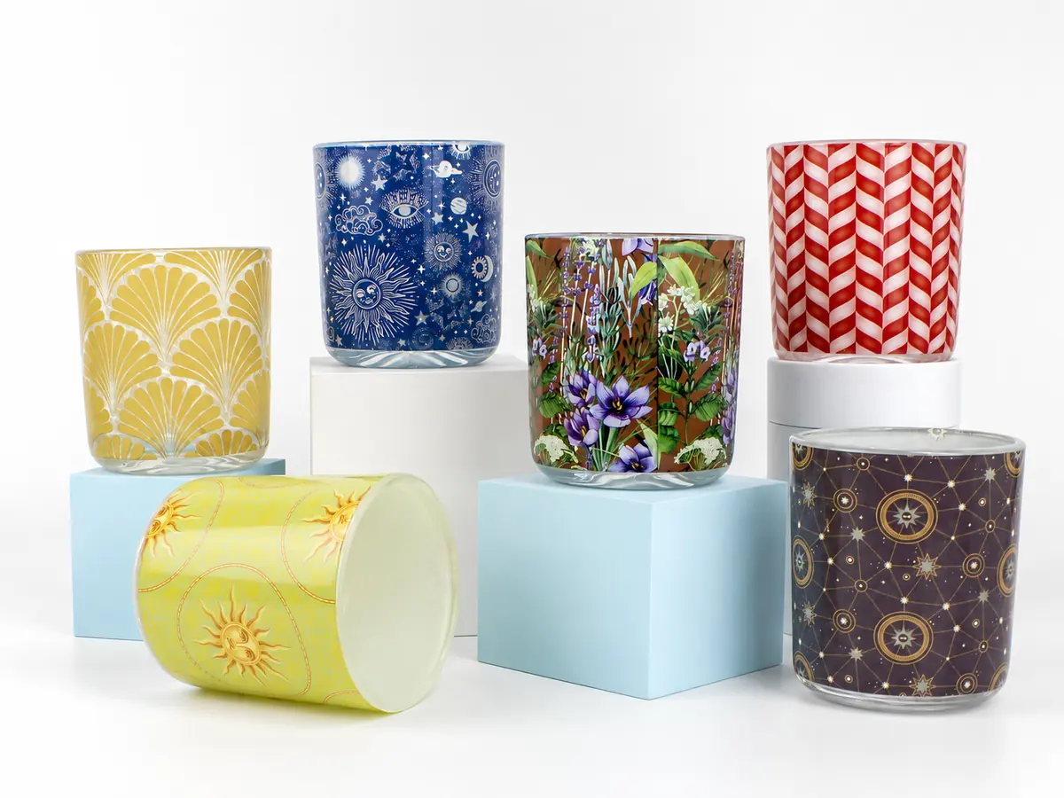 Custom glass packaging with color finishes, frosted surfaces, logo decoration and metallic branding