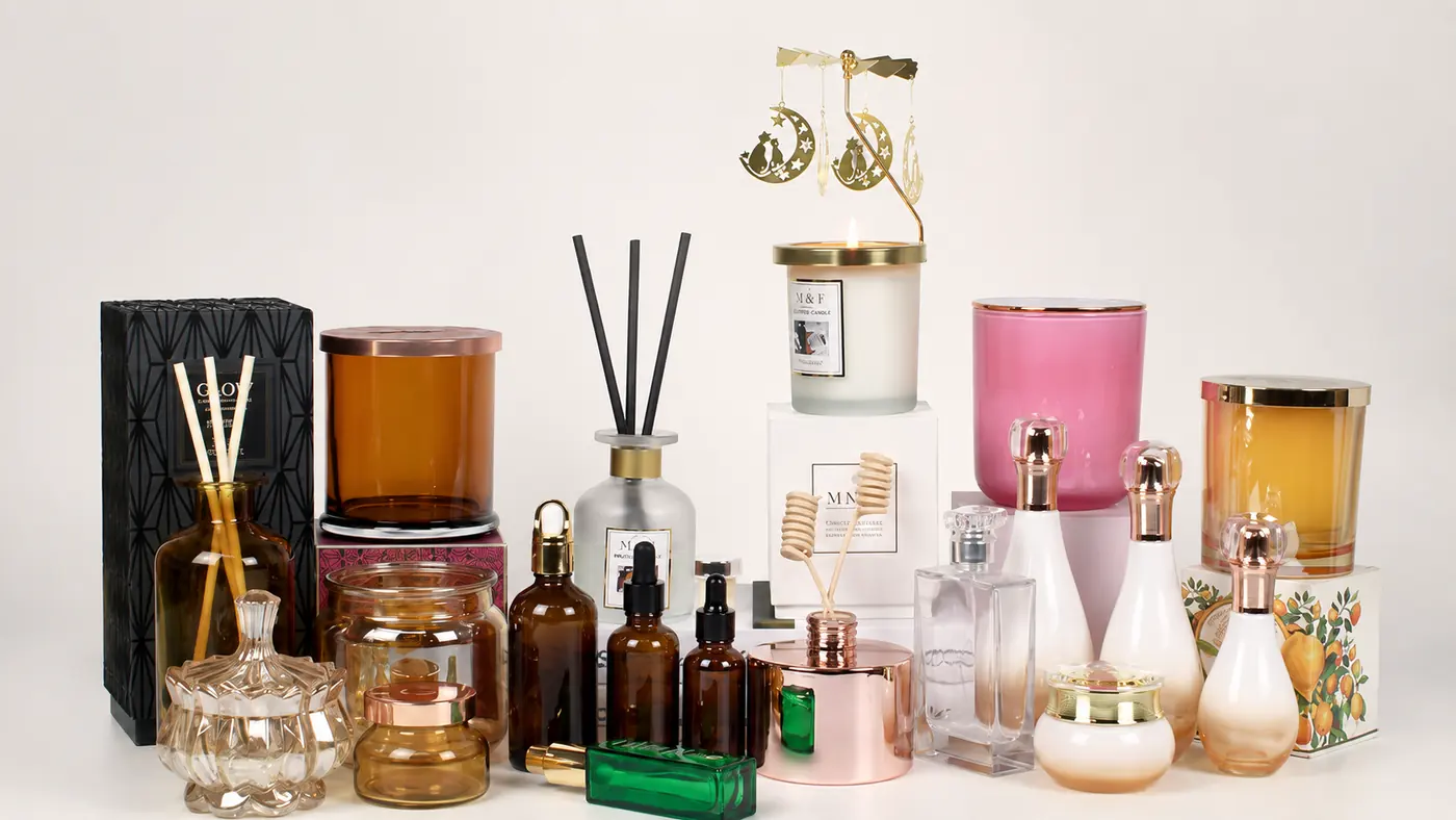 Custom glass packaging with perfume bottles, diffuser bottles, candle jars, closures and branded boxes