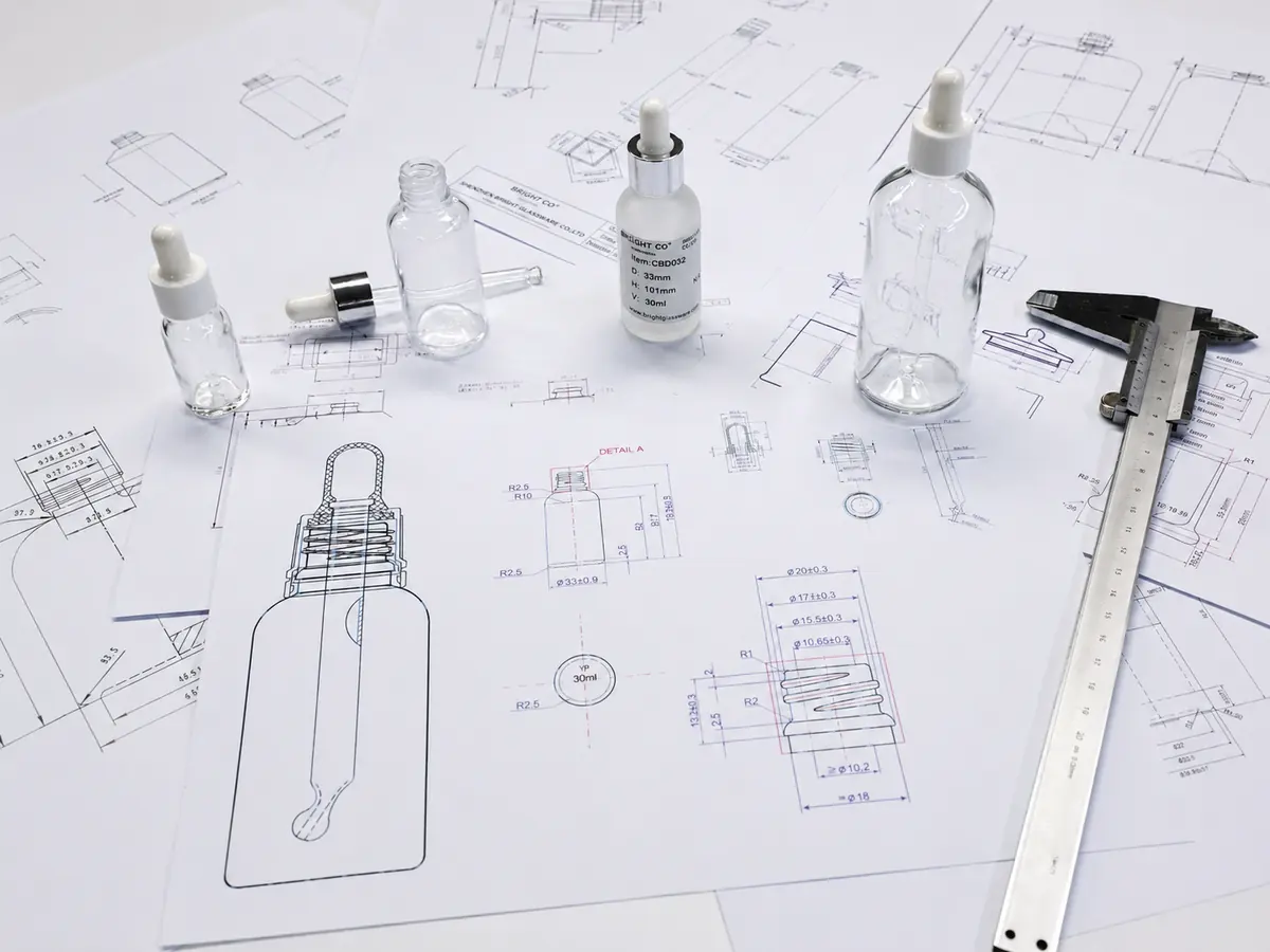 Glass packaging CAD drawing and technical development with bottle design sketches and prototypes