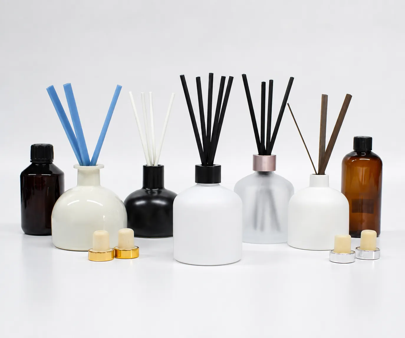 Reed diffuser glass bottle collection in white, black, frosted and amber finishes with different reed options