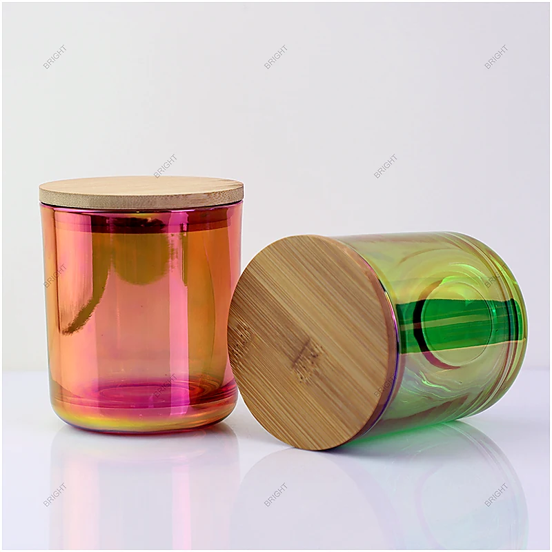 Iridescent glass candle jars with reflective rainbow finishes, bamboo lids and a lit candle