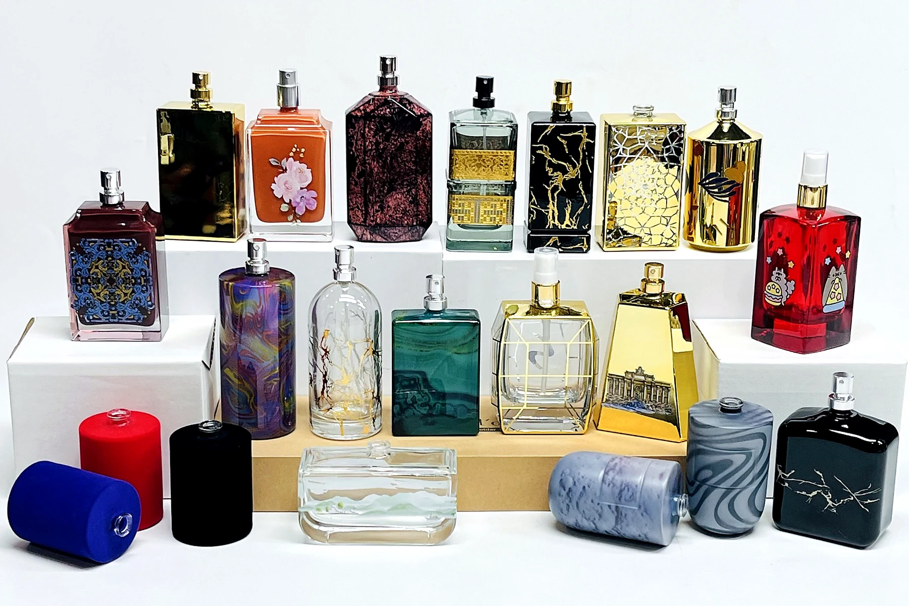 Decorated perfume bottle collection with metallic coating, printing, patterns and custom surface finishes