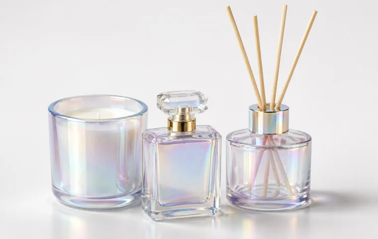 Iridescent finish glass packaging with rainbow reflective candle, perfume and diffuser containers